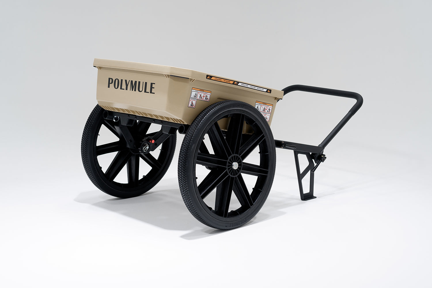 Tan WARRIOR Utility Cart with black wheels and a forward handle. Back right side view.