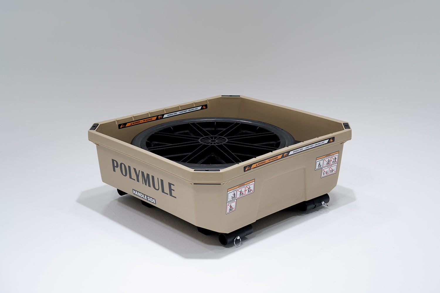 Tan WARRIOR Cart. The cart is folded into it's storage position with the handlebar and wheels in the tub.