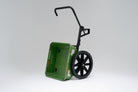 Green WARRIOR Utility Cart with black wheels and a forward handle. The cart is tipped for dumping.